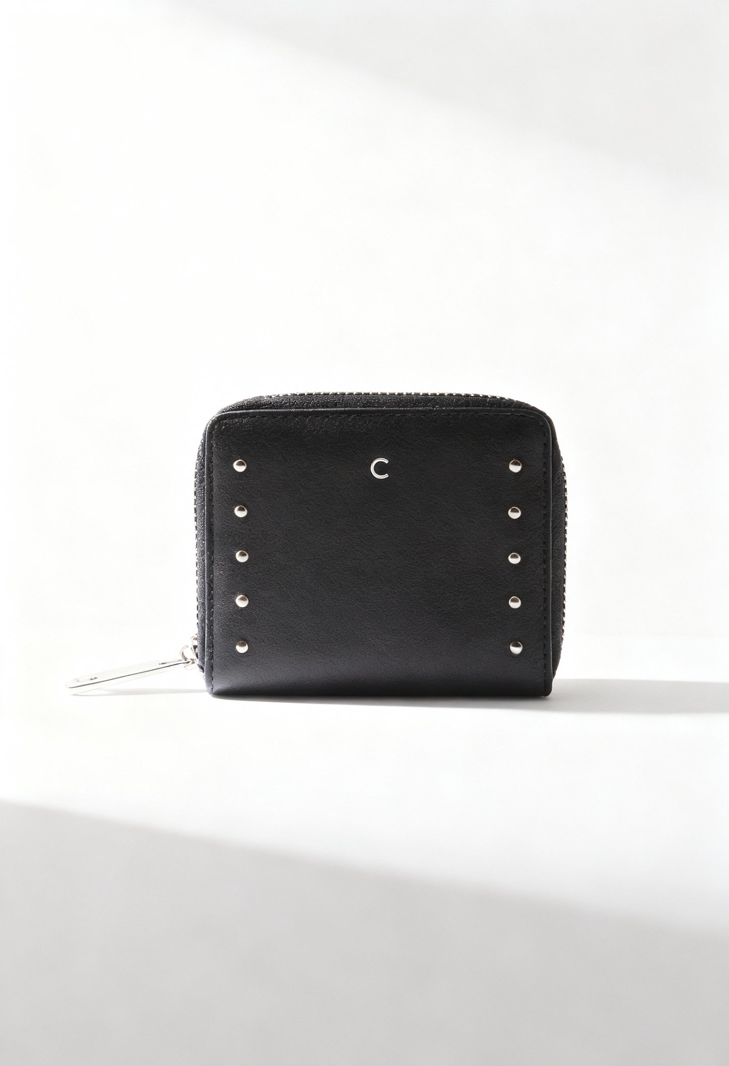 Carrera Jeans ALLIE-CB7053 black women’s studded PU wallet with zip closure, displayed in bright studio lighting.