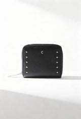 Carrera Jeans ALLIE-CB7053 black women’s studded PU wallet with zip closure, displayed in bright studio lighting.
