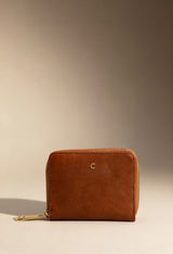 Carrera Jeans LILY-CB7013 brown women’s zip wallet with textured PU finish, displayed in warm studio lighting.