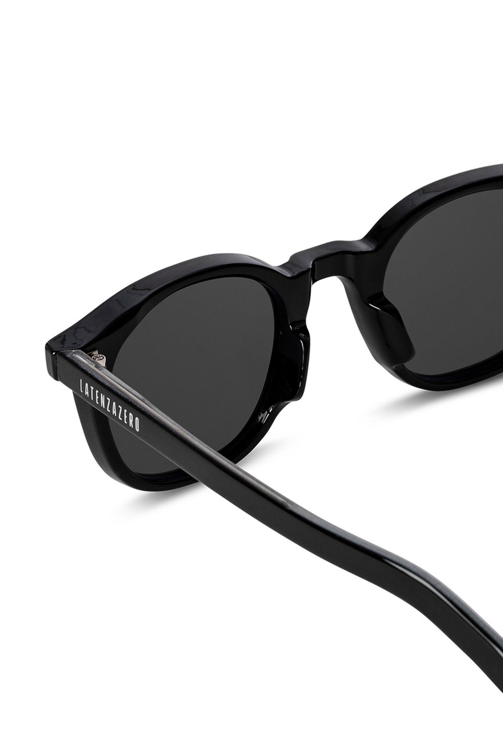 Close-up of LatenzaZero Zenith sunglasses highlighting glossy black acetate finish and UV3 lenses.