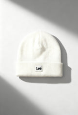 Lee LP5940NQ white unisex ribbed knit beanie hat with folded cuff and Lee logo, shown in bright studio lighting.