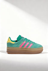 Adidas Gazelle Bold W women's platform sneakers in green suede with pink stripes.