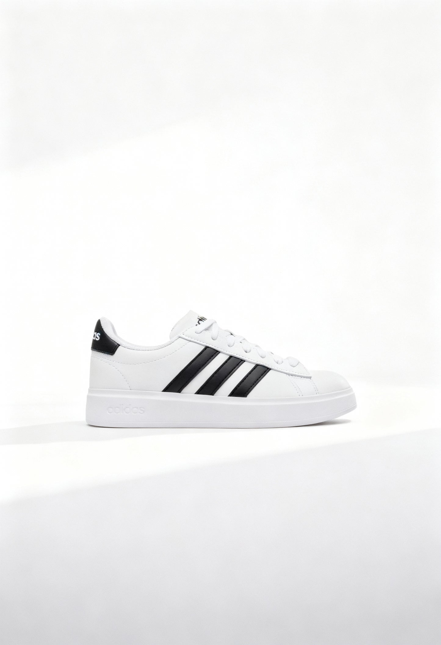 Brand new Adidas Grand Court 2.0 men's sneakers in core white with black 3-stripes side view.