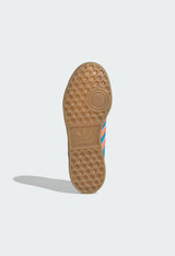 Detailed view of the gum rubber outsole and honeycomb tread on Adidas Hamburg sneakers.