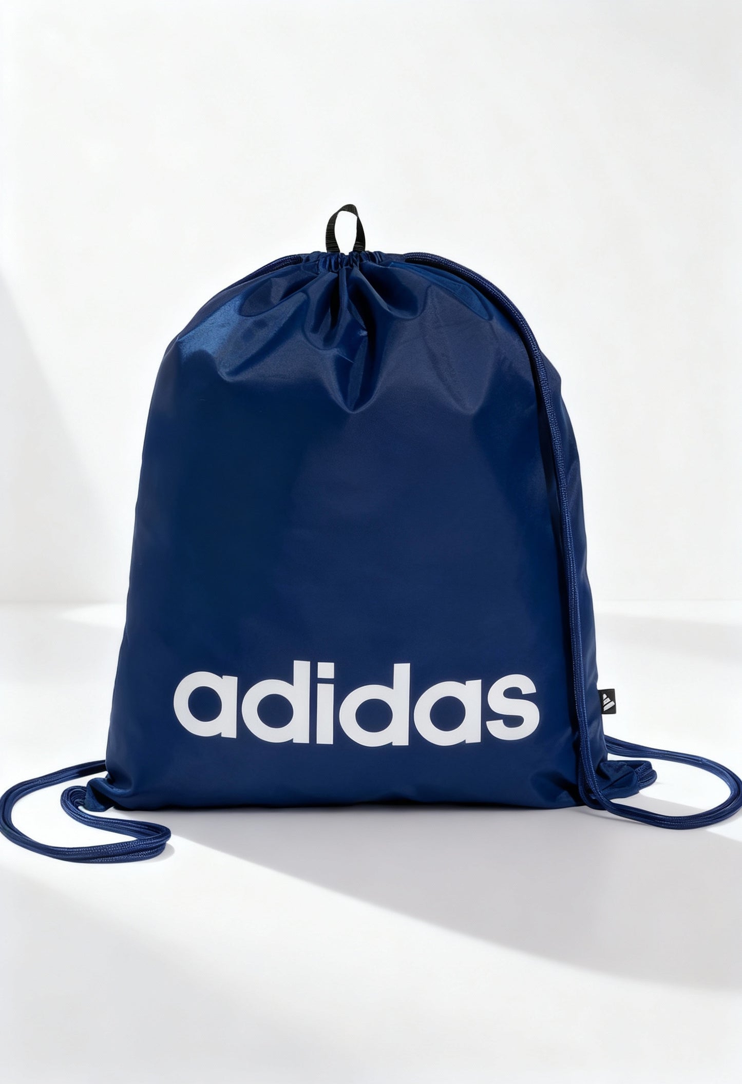 Brand new Adidas Linear Gymsack in blue with white logo and drawcord straps.