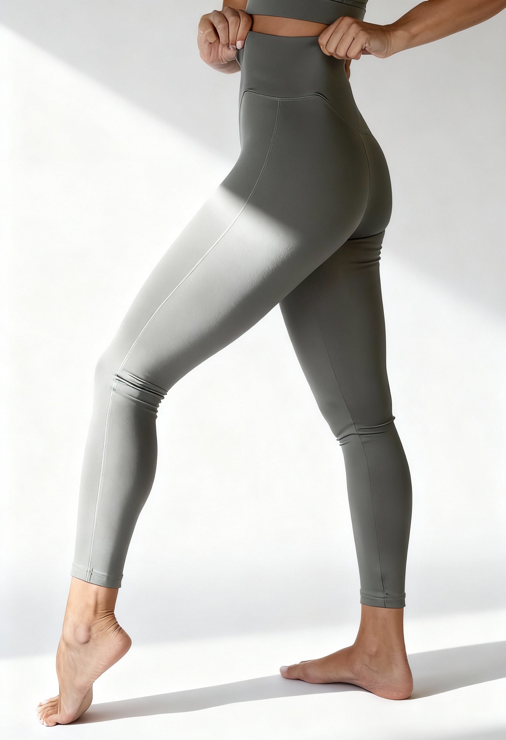 Bodyboo BB23956 high-waist shaping leggings in sage green, worn by model.