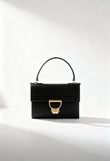 Brand new Coccinelle Arlettis Mini black leather handbag with gold buckle closure.