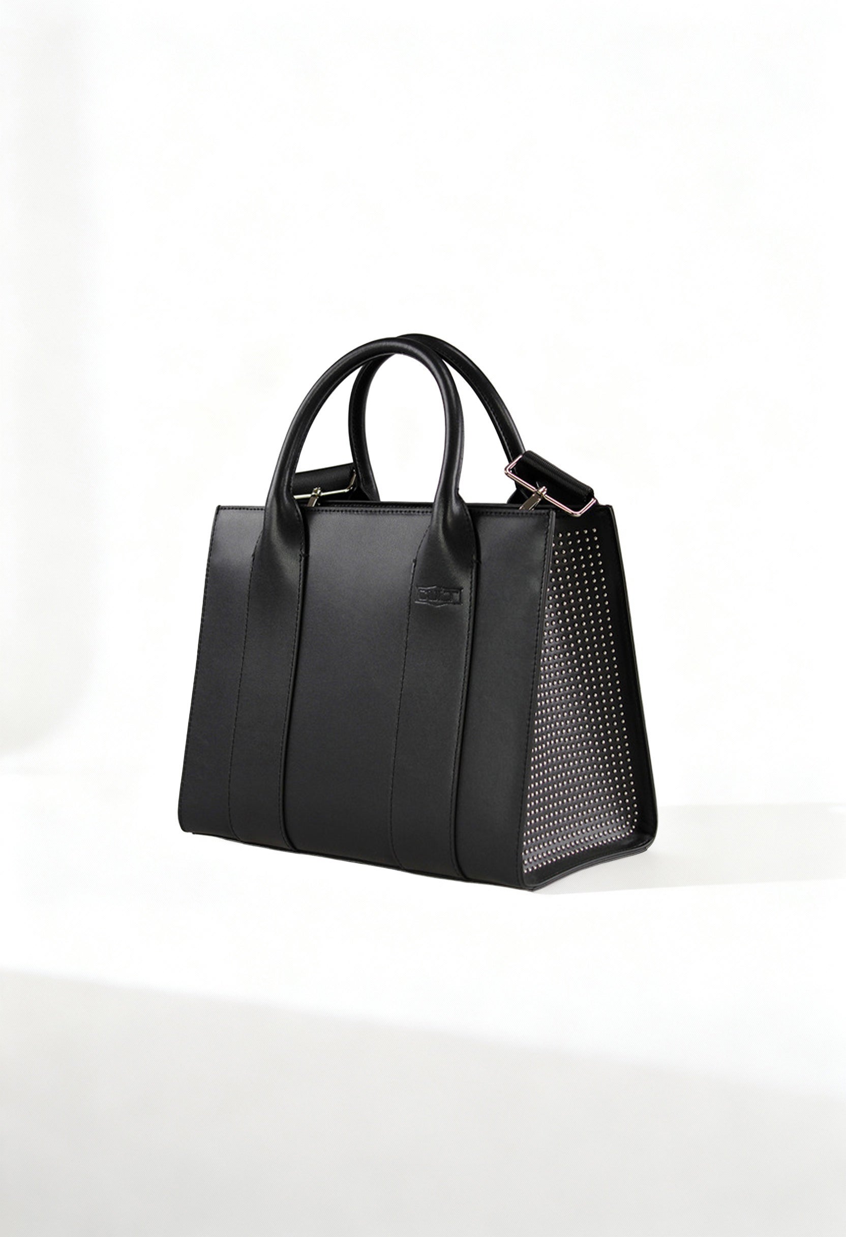 Front angle of the black Cult structured handbag with leather-blend finish and textured side panels.