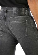 Diesel dark grey jeans, close-up of back pocket and yoke detail.