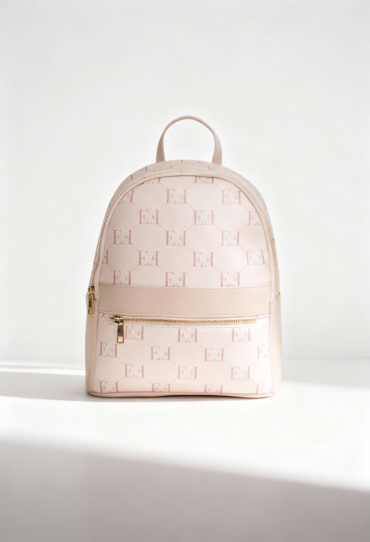 Egon Von Furstenberg JOY monogram PU backpack in light tan, front view.