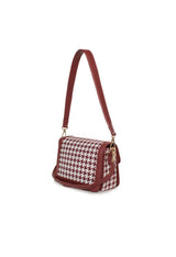 Side-angle view of the burgundy Alison handbag highlighting its structure and removable strap.