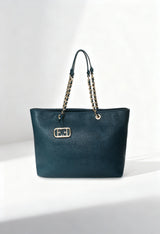 Front view of the dark teal Noemi woman shoulder bag with chain handles on a light background.