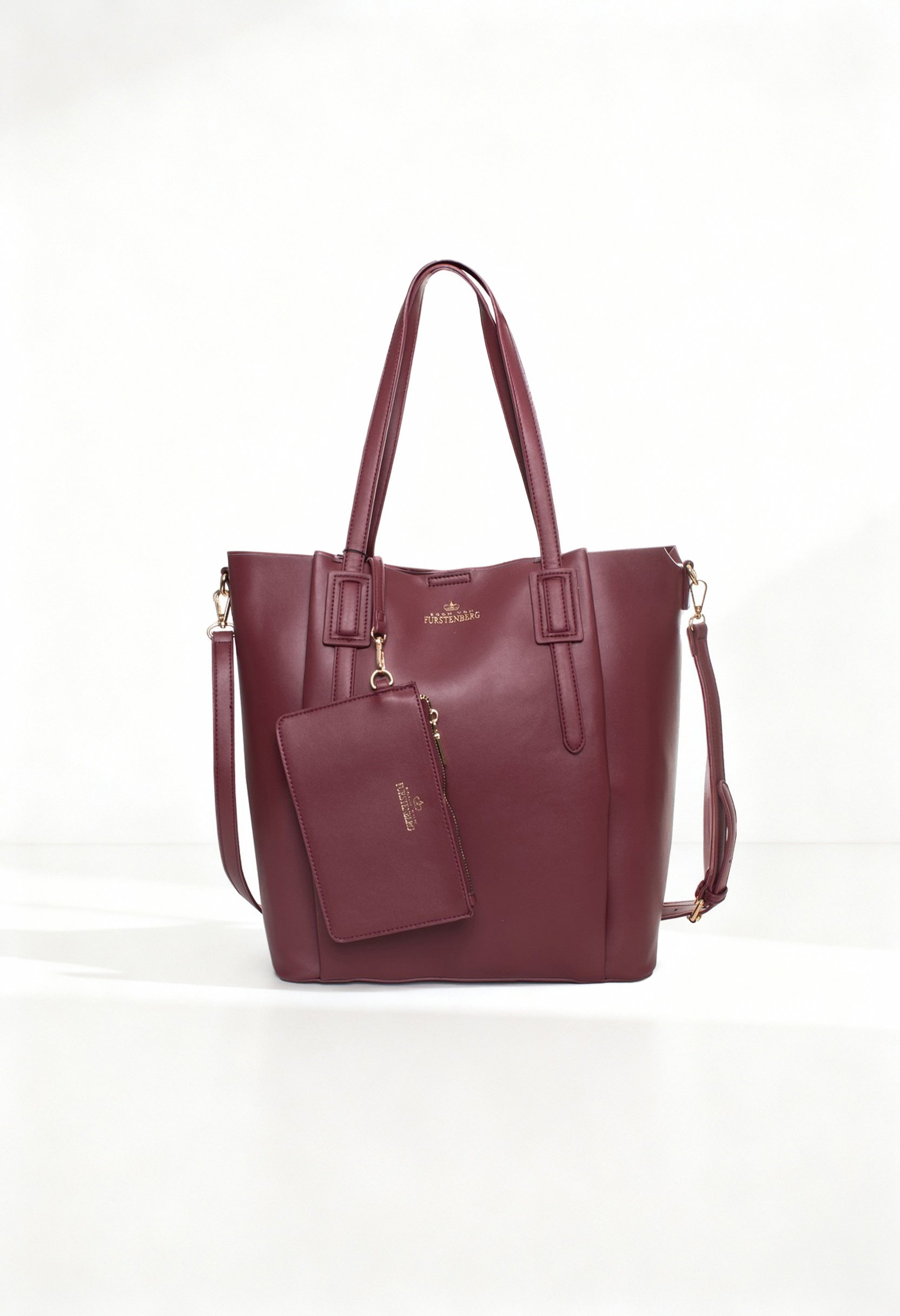 Front angled view of the Egon Von Furstenberg EVF1622-GIADA burgundy luxury shoulder bag with dual handles.