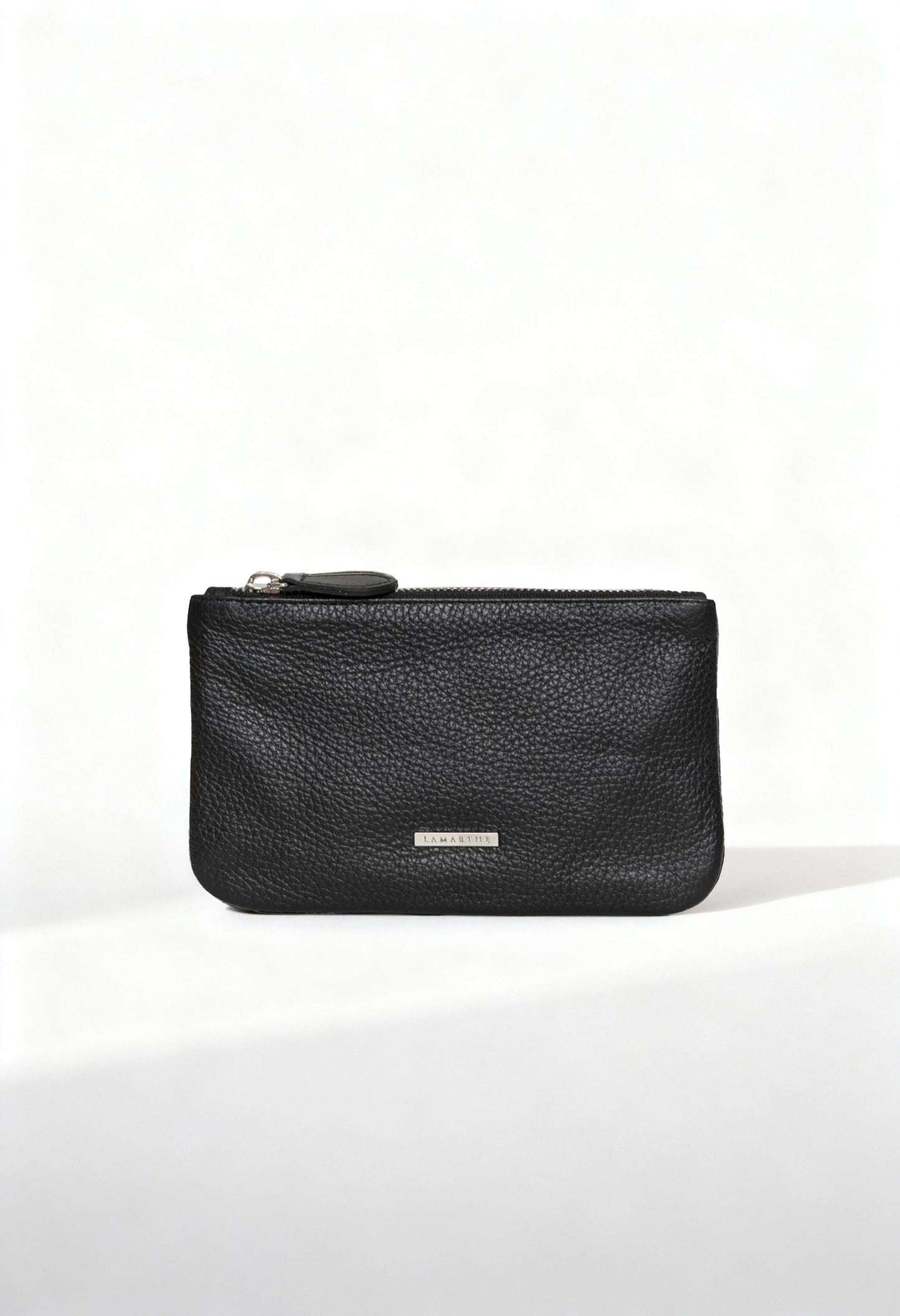 Front view of the Lamarthe TRE103 large black textured leather clutch with metallic logo plate.