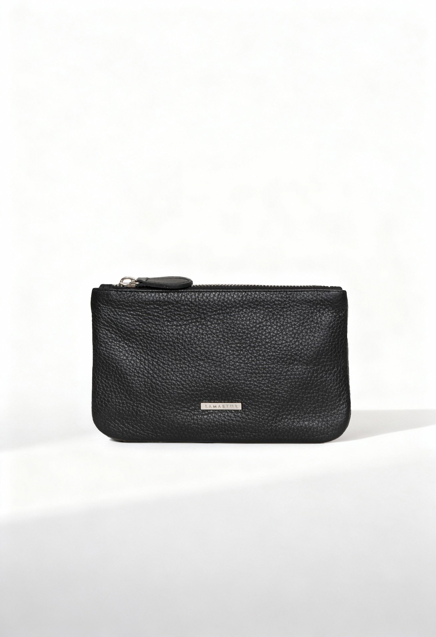 Front view of the Lamarthe TRE103 large black textured leather clutch with metallic logo plate.
