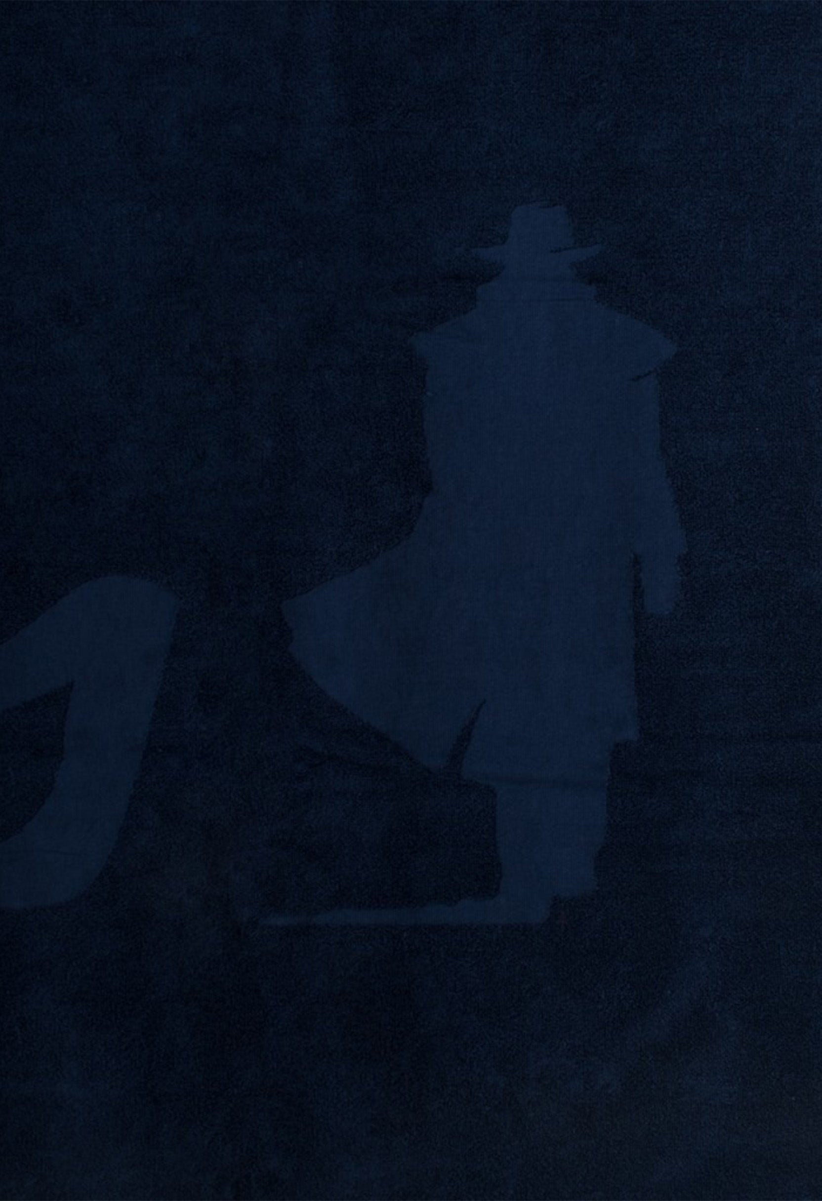 MCS unisex beach towel in navy, close-up folded view showing fabric texture.