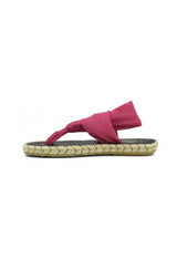 Full side profile of the pink Nalho NA0038 flip-flop sandals with cross-straps and textured braided detail.