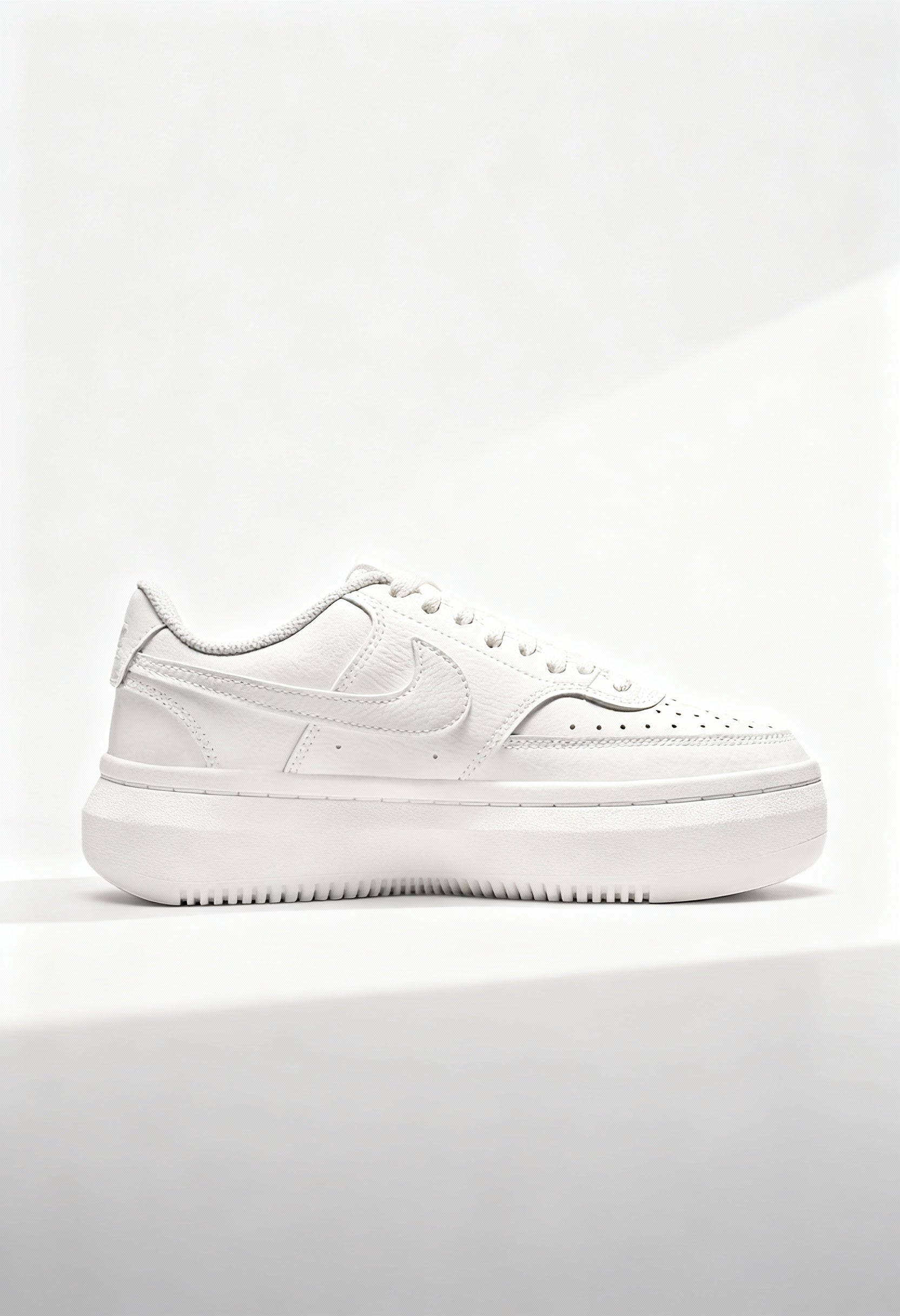 Brand new Nike Court Vision Alta women's sneakers in triple white side view.