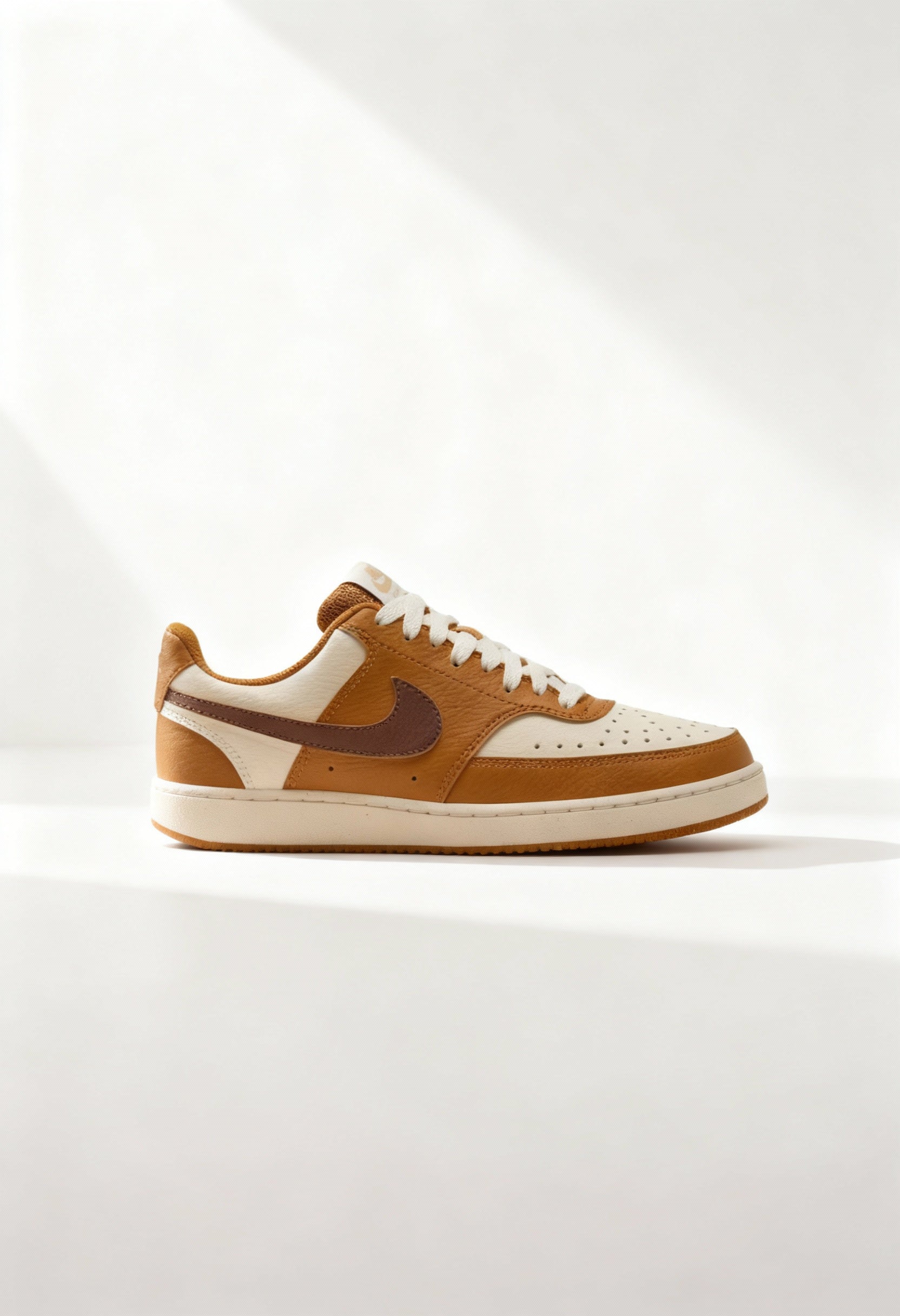 Brand new Nike Court Vision Low Next Nature women's sneakers in tan and brown side view.