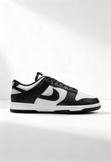 Brand new Nike Dunk Low Next Nature women's sneakers in black and white side view.