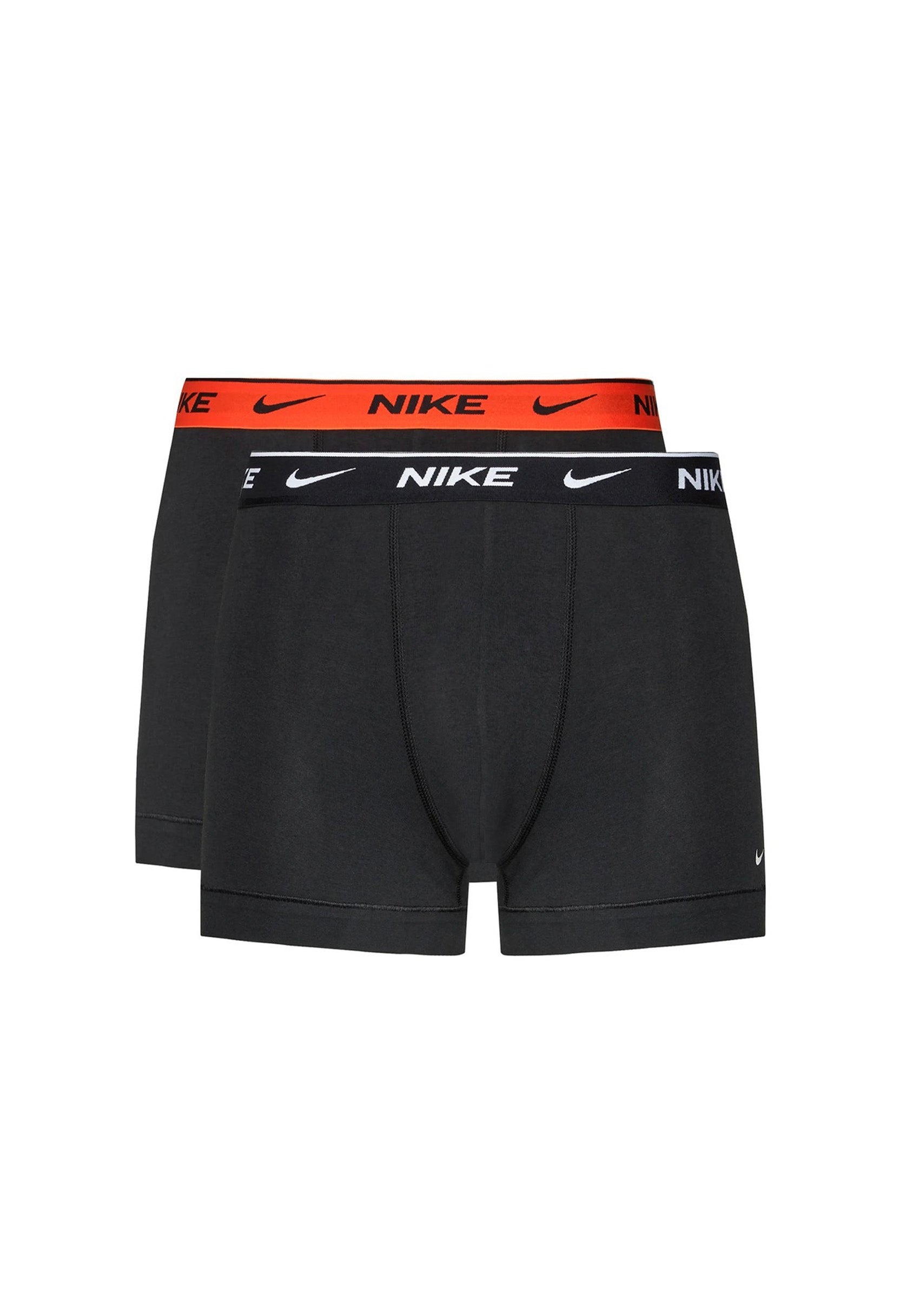 Nike men's polyester stretch underwear in a pack, showing red and black waistband variants.