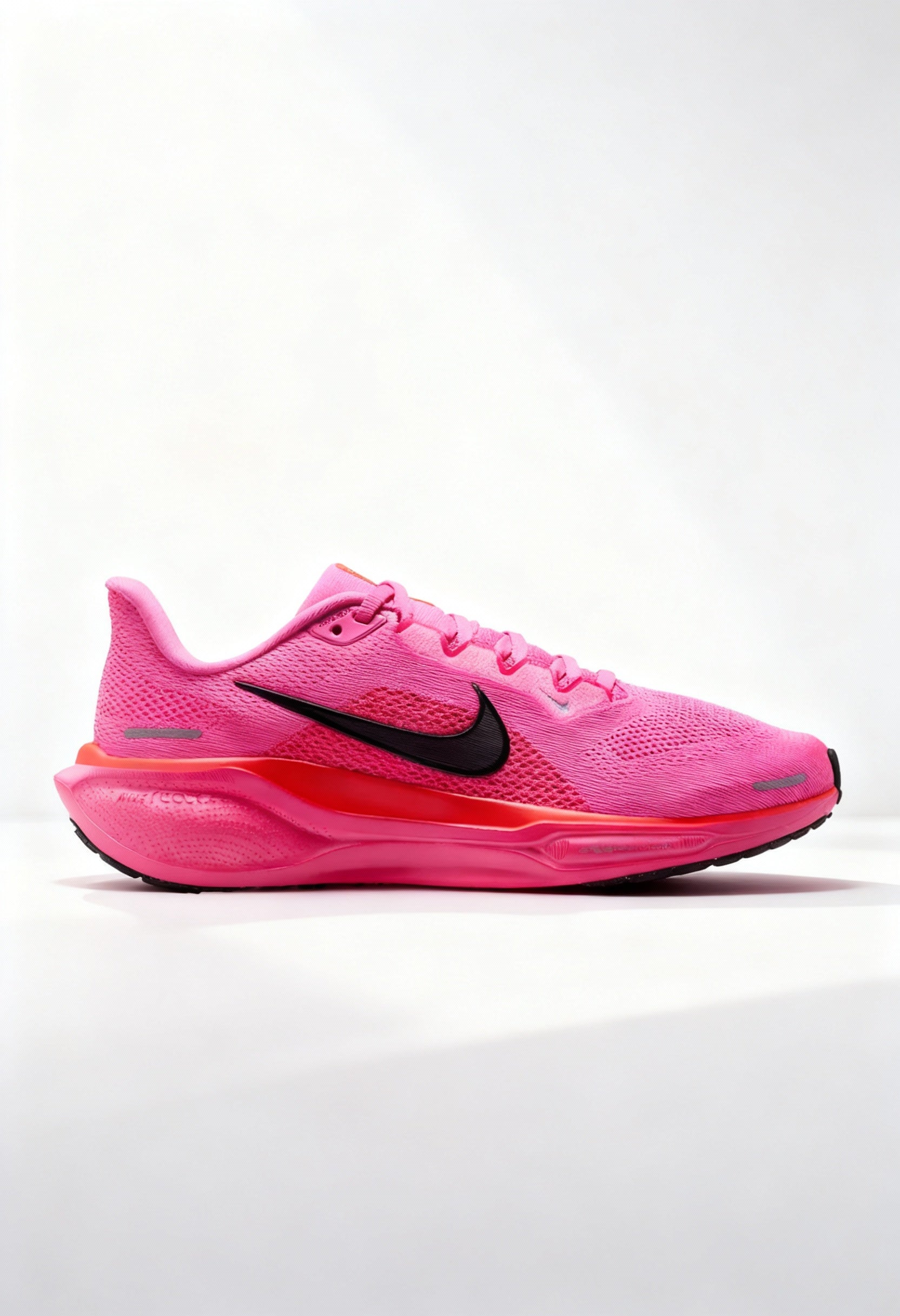 Brand new Nike Pegasus 41 women's running shoes in vibrant pink side view.