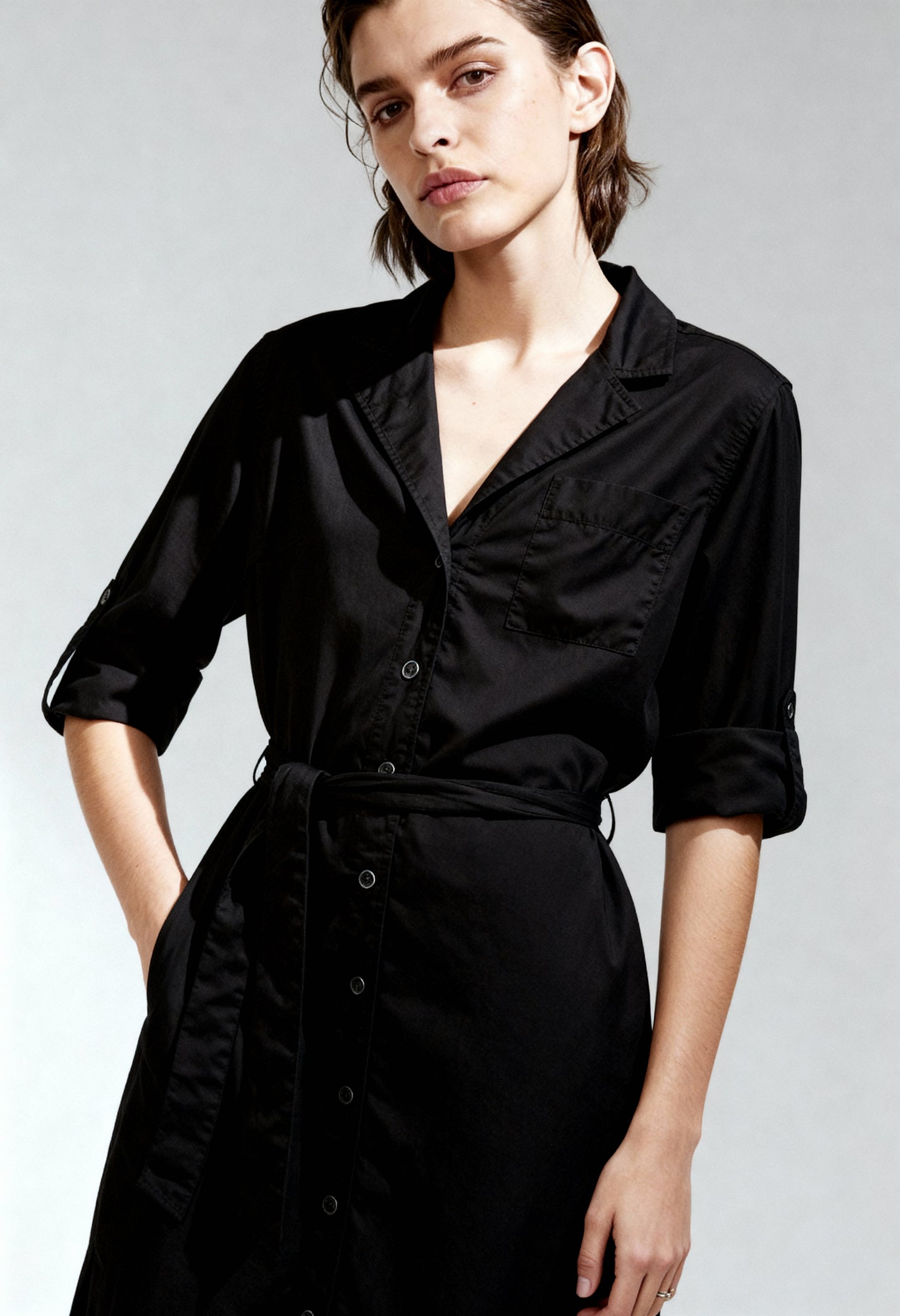 Front angled view of a woman wearing the black Pepe Jeans EDAN_PL952813 long-sleeve dress.
