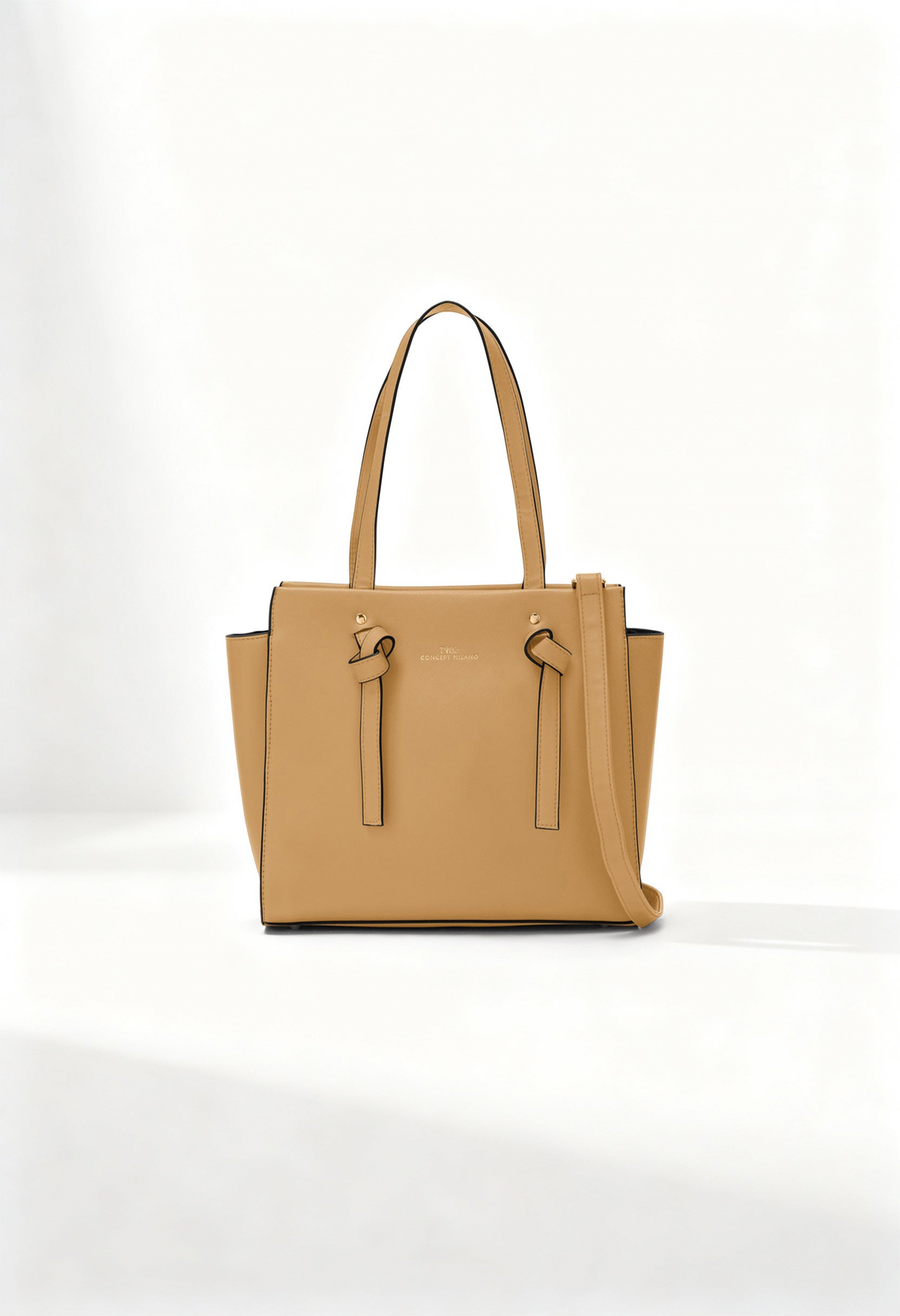 Front angle of the beige Twig Debussy shoulder bag with structured silhouette and knot detailing.