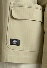 Close-up detail of the Vans logo tag on the beige VN000HJRD3Z1 jacket.
