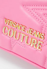 Close-up of the Versace Jeans Couture gold logo on the pink crossbody bag.